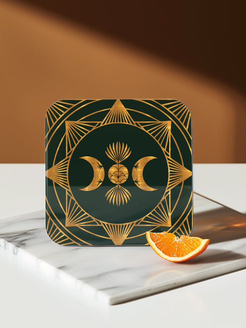 A set of four square coasters with a glossy finish, featuring celestial gold designs on a deep forest green background. Each coaster showcases a unique motif: a stylized sun with a serene face, a crescent moon with a star, a triple moon symbol with botanical elements, and a radiant sunburst. The intricate gold linework creates an art deco-inspired, mystical aesthetic. Made from durable materials, these coasters blend elegance with celestial charm.